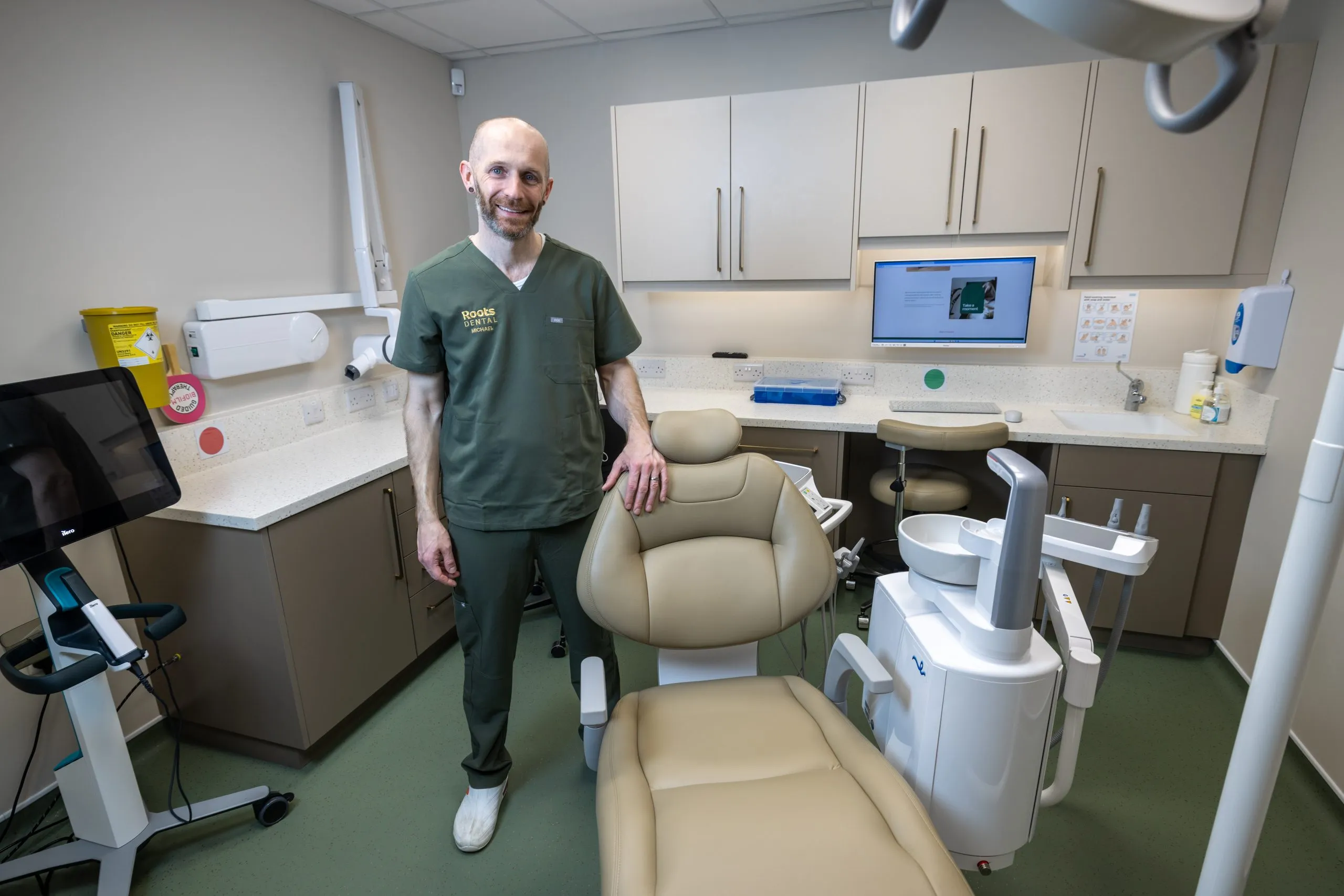 Dentist in a completed surgery with new equipment at Roots Dental, Morpeth