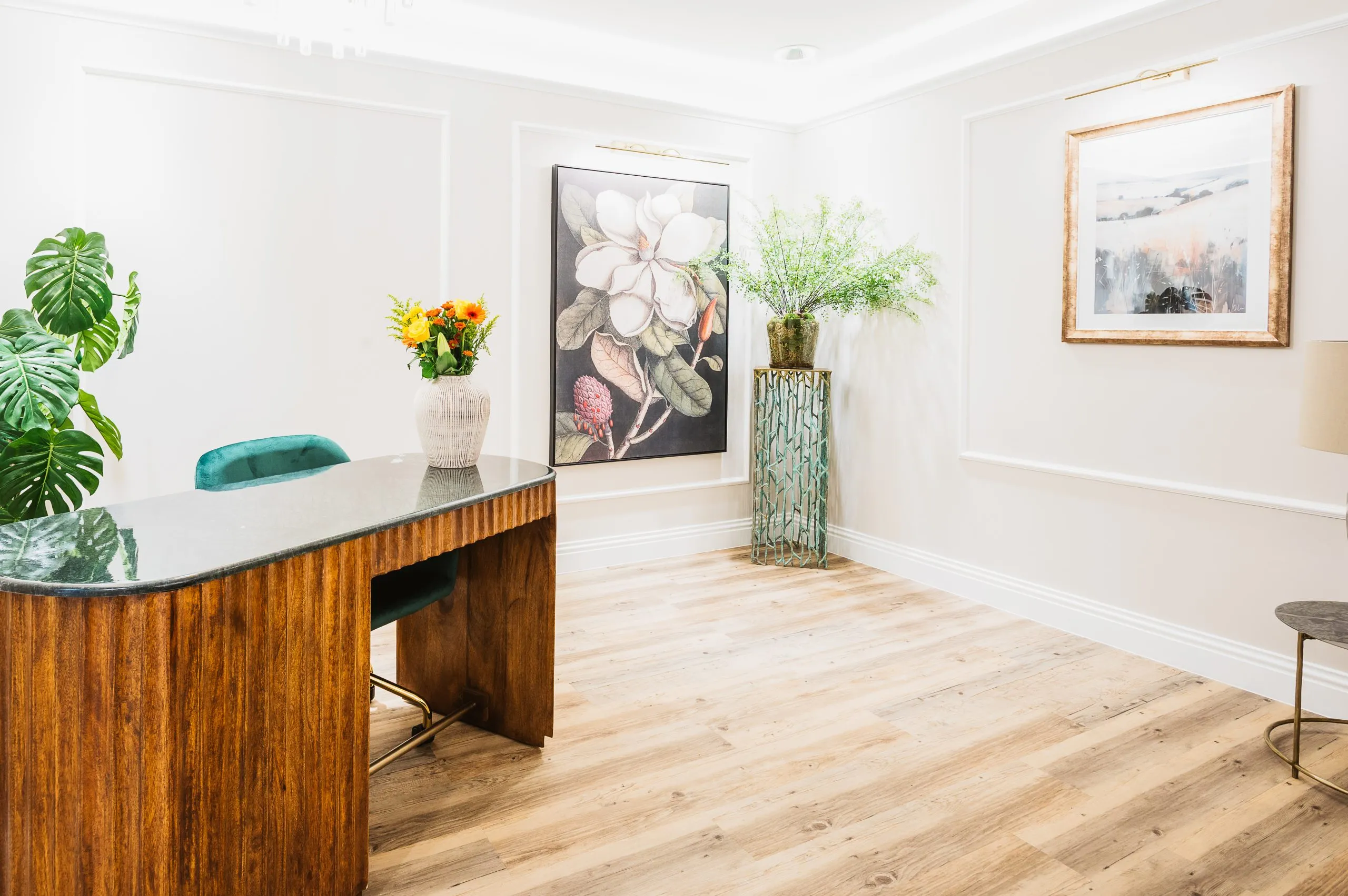 Walnut consultation desk in the treatment co-ordination area at Bright Orthodontics, Liverpool