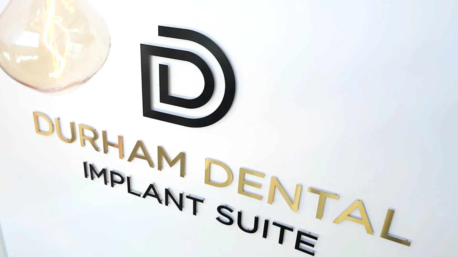 Durham Dental Implant Suite logo signage